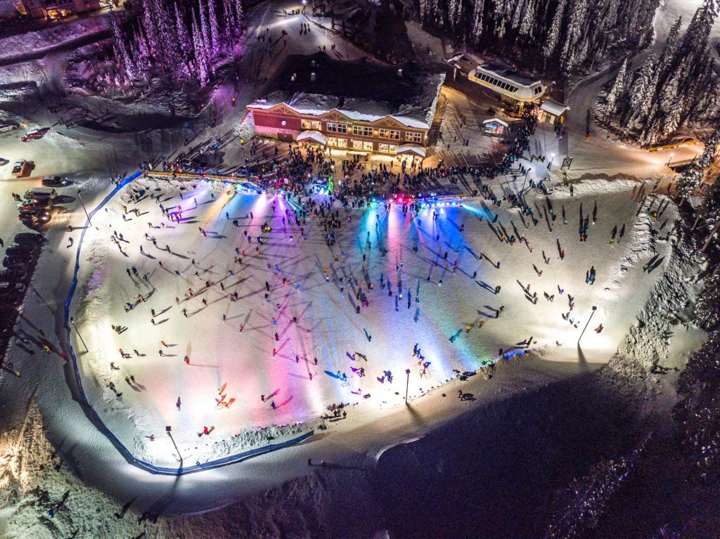 Nighttime ice skating at Big White Ski Resort, one of the most popular winter sports in Kelowna