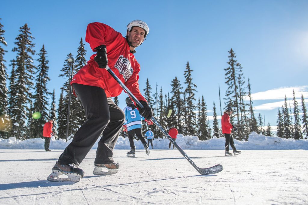 Ice hockey players enjoying winter sports at Big White Ski Resort