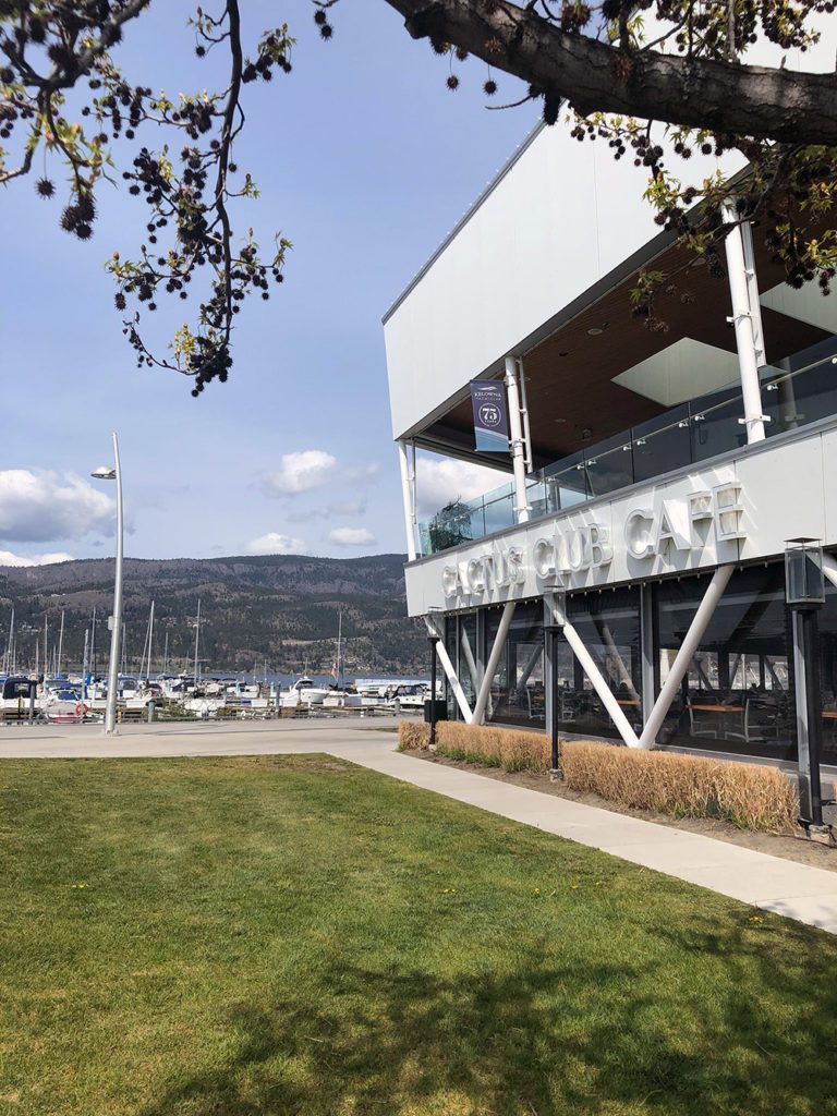 Kelowna's Yacht Club Cactus Club location, looking out over the marina with boats and the lake. 