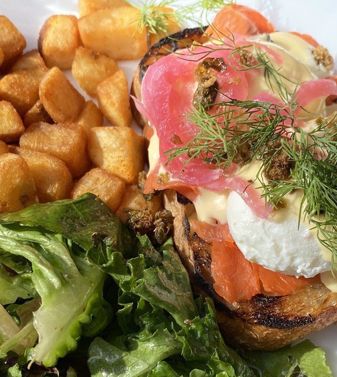 easy e benedict from krafty kitchen's hip hop brunch, featuring a breakfast of salmon, dill, hashbrowns, eggs and greens